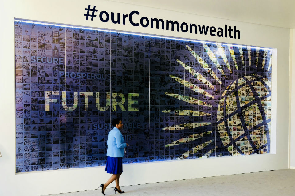 Large wall poster with woman walking in front